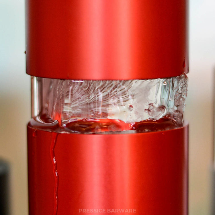 Red ice ball press melting a block of ice into a perfect sphere in less than a minute. By pressice barware

